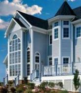3 story house with black roof in El Dorado CA
